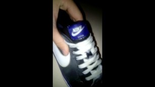 Teen Spit his Black Nike Sneakers