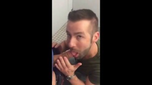 Handsome guy sucks dick in restroom stall